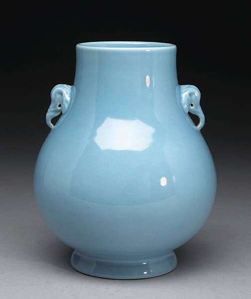 Appraisal: A sky-blue glazed porcelain vase with elephant head handles Yongzheng