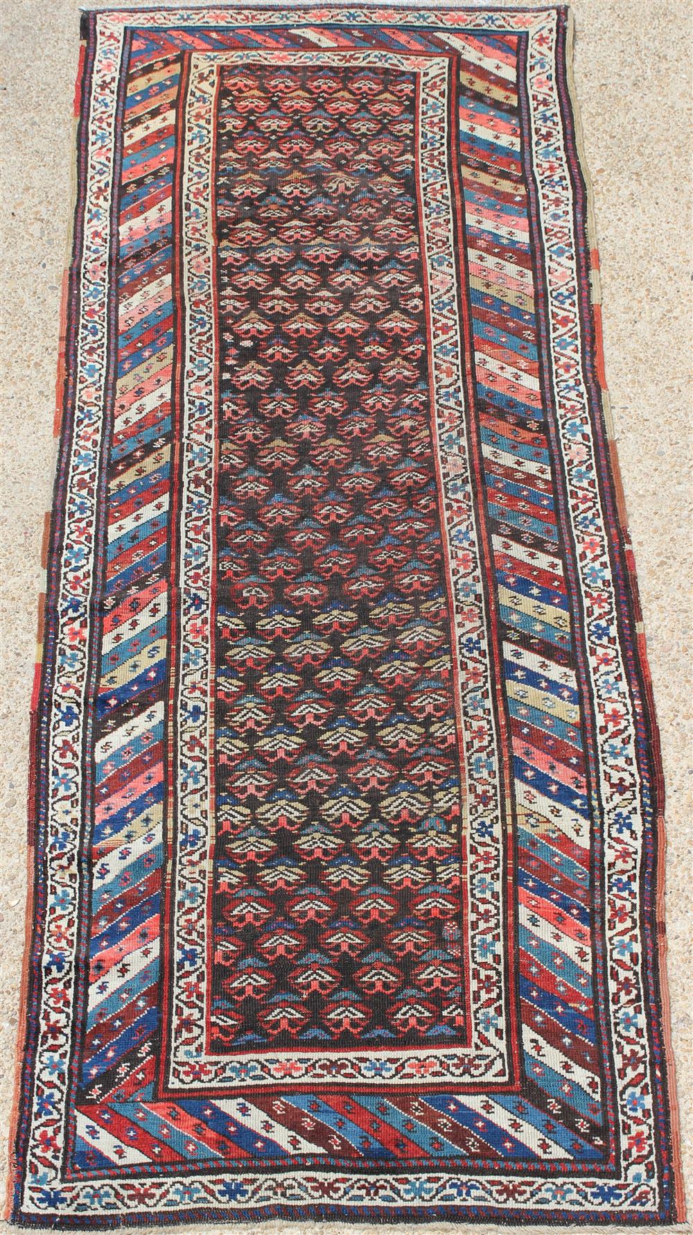 Appraisal: CAUCASUS KAZAK WOOL RUNNER colors include gold blue rust taupe