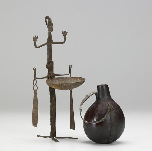 Appraisal: AFRICAN OIL LAMP AND GOURD VESSEL Hand-hammered iron figural oil