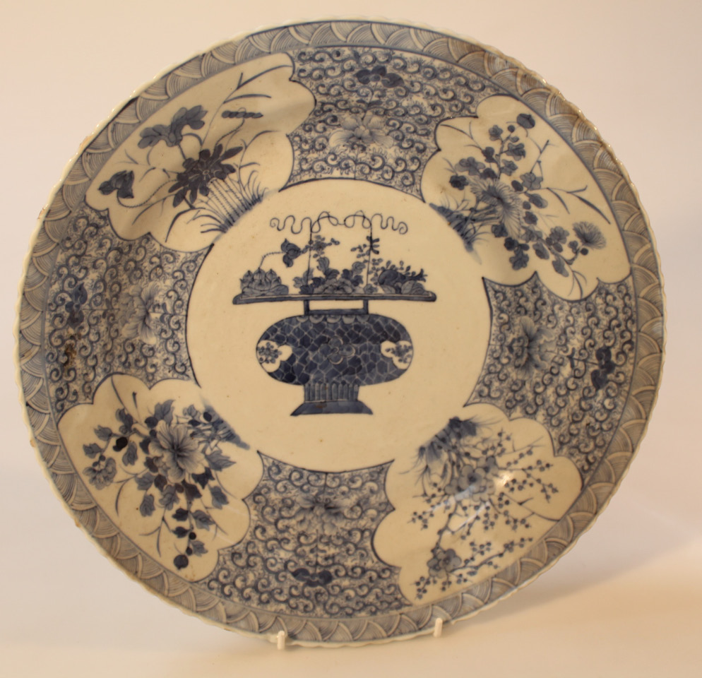 Appraisal: An oriental blue and white porcelain plate with a shaped