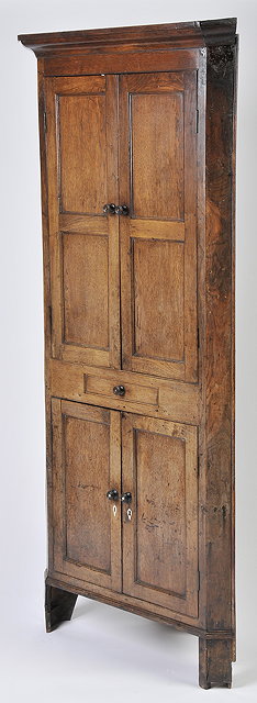 Appraisal: A TH CENTURY OAK FULL LENGTH CORNER CUPBOARD with panelled