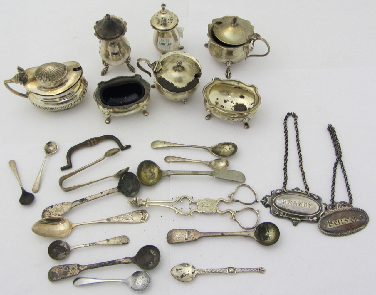 Appraisal: Silver comprising a pair of scissor action sugar nips a