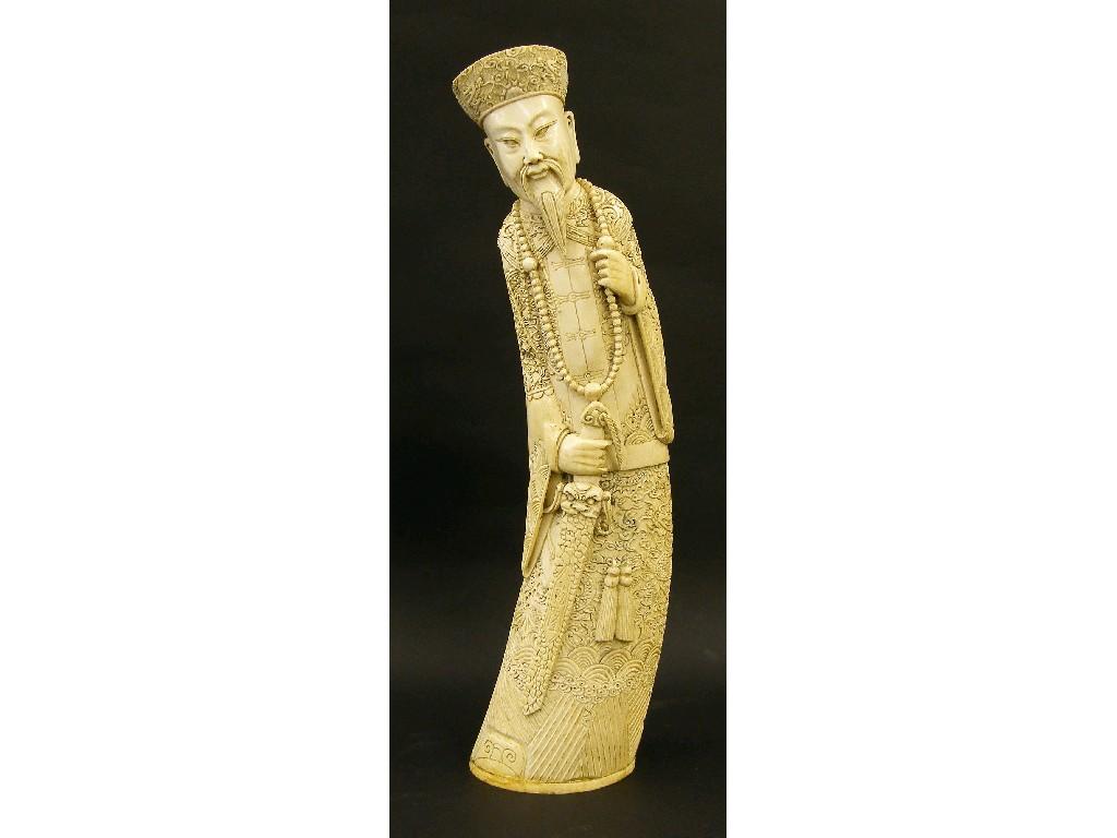 Appraisal: Large carved ivory tusk modelled as a bearded warrior in