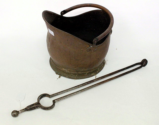 Appraisal: A GEORGIAN STEEL FIRE TONG cm in length together with