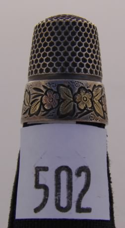 Appraisal: Thimble with two tone floral design on band