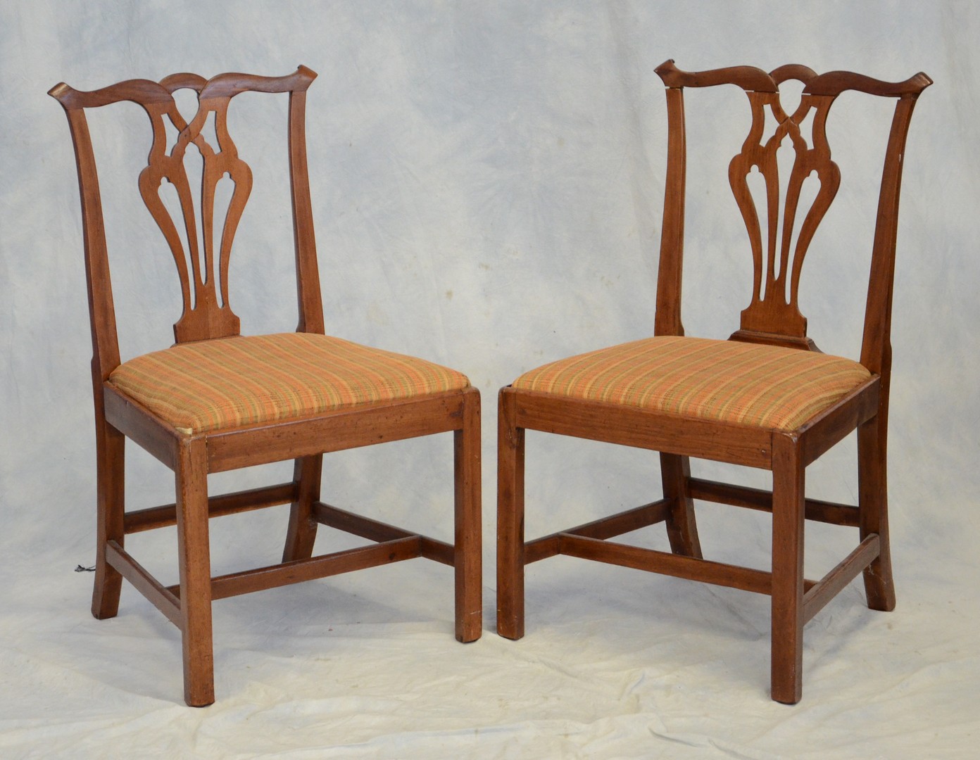 Appraisal: Pair of Chippendale chairs with orange and beige striped upholstered