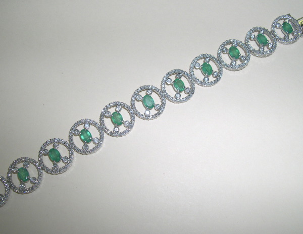 Appraisal: Fourteen-Karat White Gold Emerald and Diamond Link Bracelet composed of