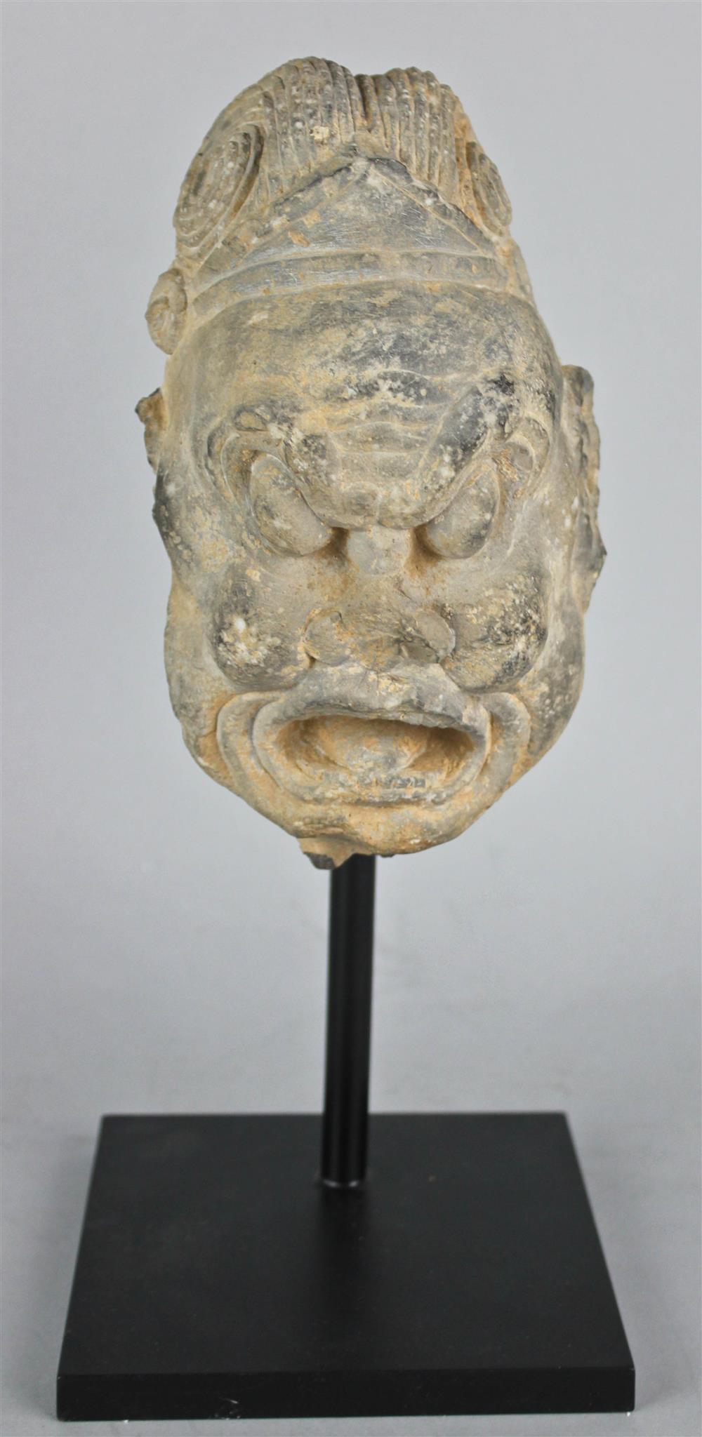 Appraisal: CHINESE STONE HEAD OF A DEMON TANG DYNASTY the grey