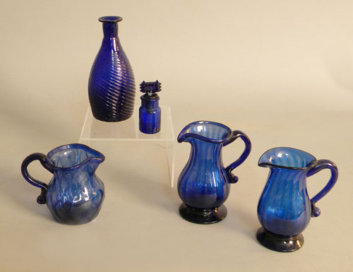 Appraisal: Three cobalt glass creamers together with a scent bottle and