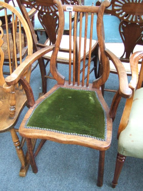 Appraisal: An early th century beech framed open armchair with lyre