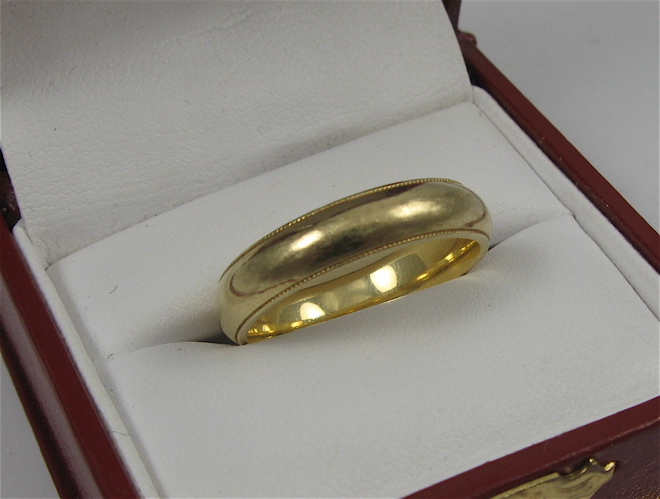 Appraisal: MAN'S AND LADY'S K GOLD WEDDING BANDS The man's weighing