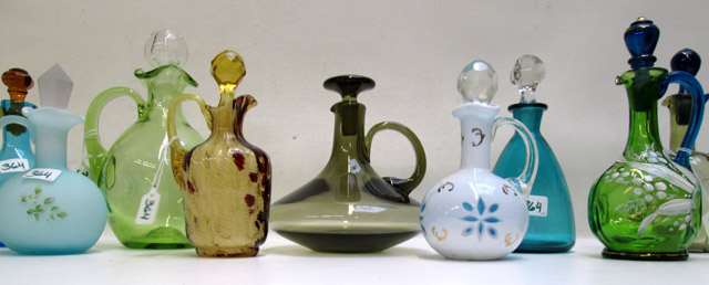 Appraisal: TWELVE GLASS CRUETS WITH STOPPERS in various colors and shapes