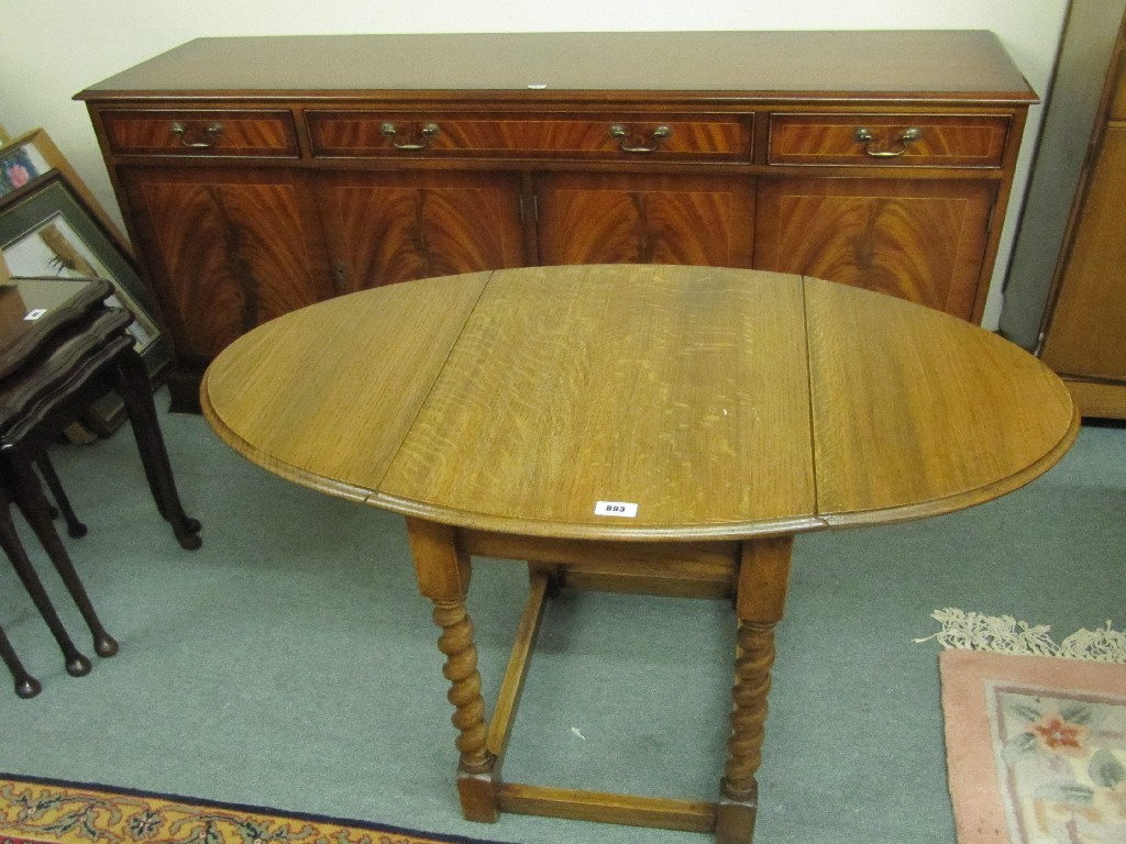 Appraisal: Reproduction sideboard and an oak dropleaf table