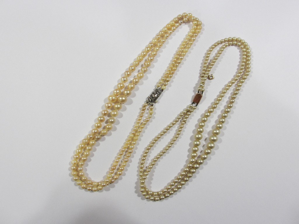 Appraisal: Lot comprising a double strand of cultured pearls with silver