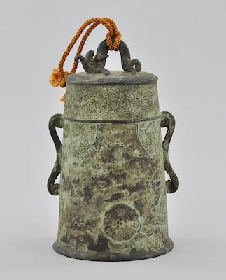 Appraisal: An Archiastic Style Chinese Bronze Bell With a mottled verdegris