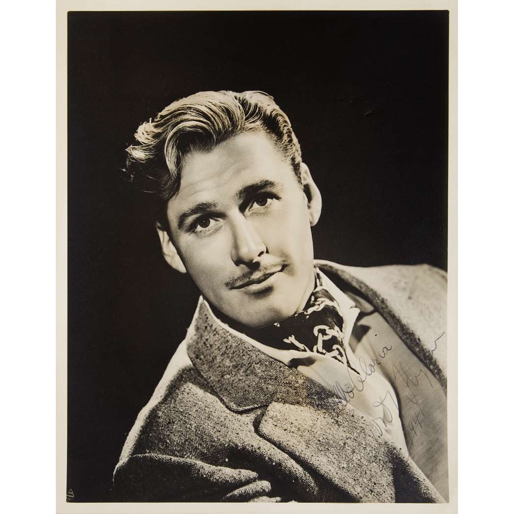 Appraisal: FLYNN ERROL Photograph inscribed Vintage photographic portrait of Flynn inscribed