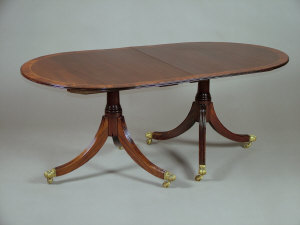 Appraisal: A Regency style mahogany and inlaid twin pedestal dining table