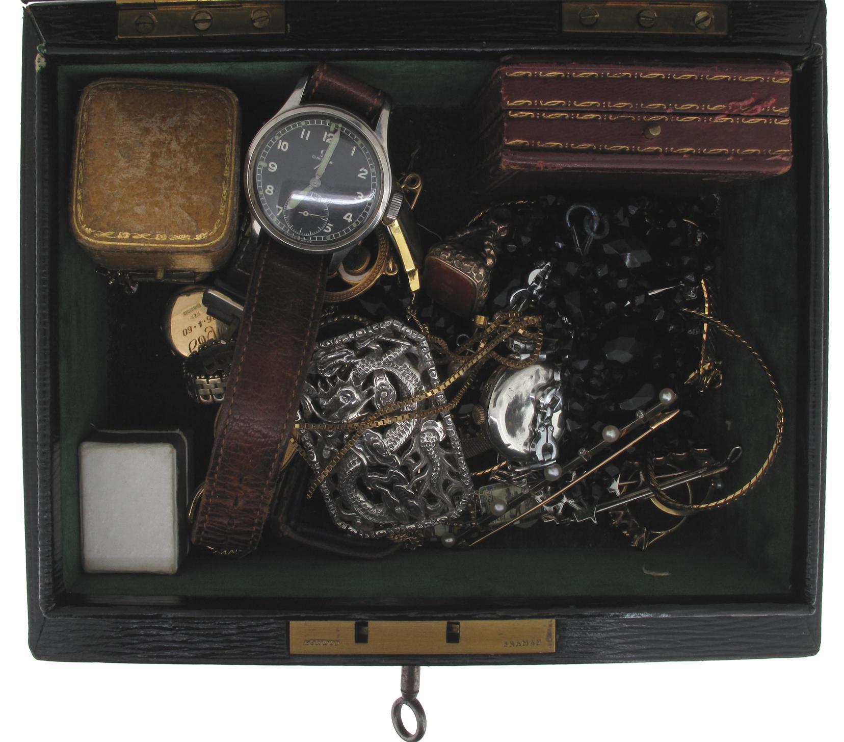 Appraisal: A small leather jewellery casket containing various items of