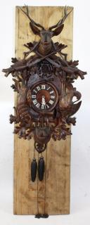 Appraisal: Large scale Black Forest German Cuckoo clock with carved focal