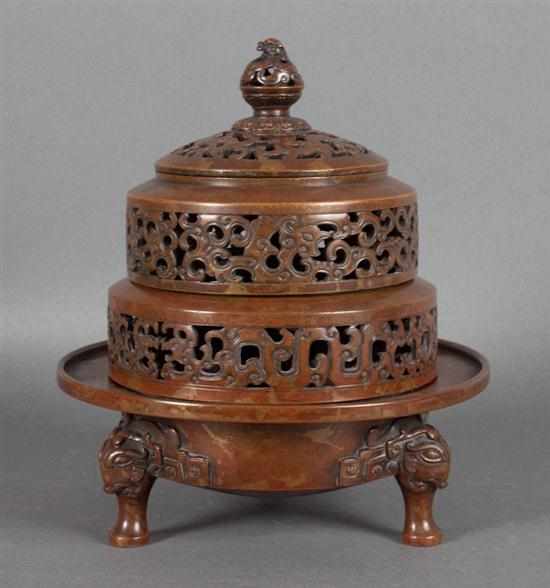 Appraisal: Chinese bronze four-part censer th century reticulated lid with two