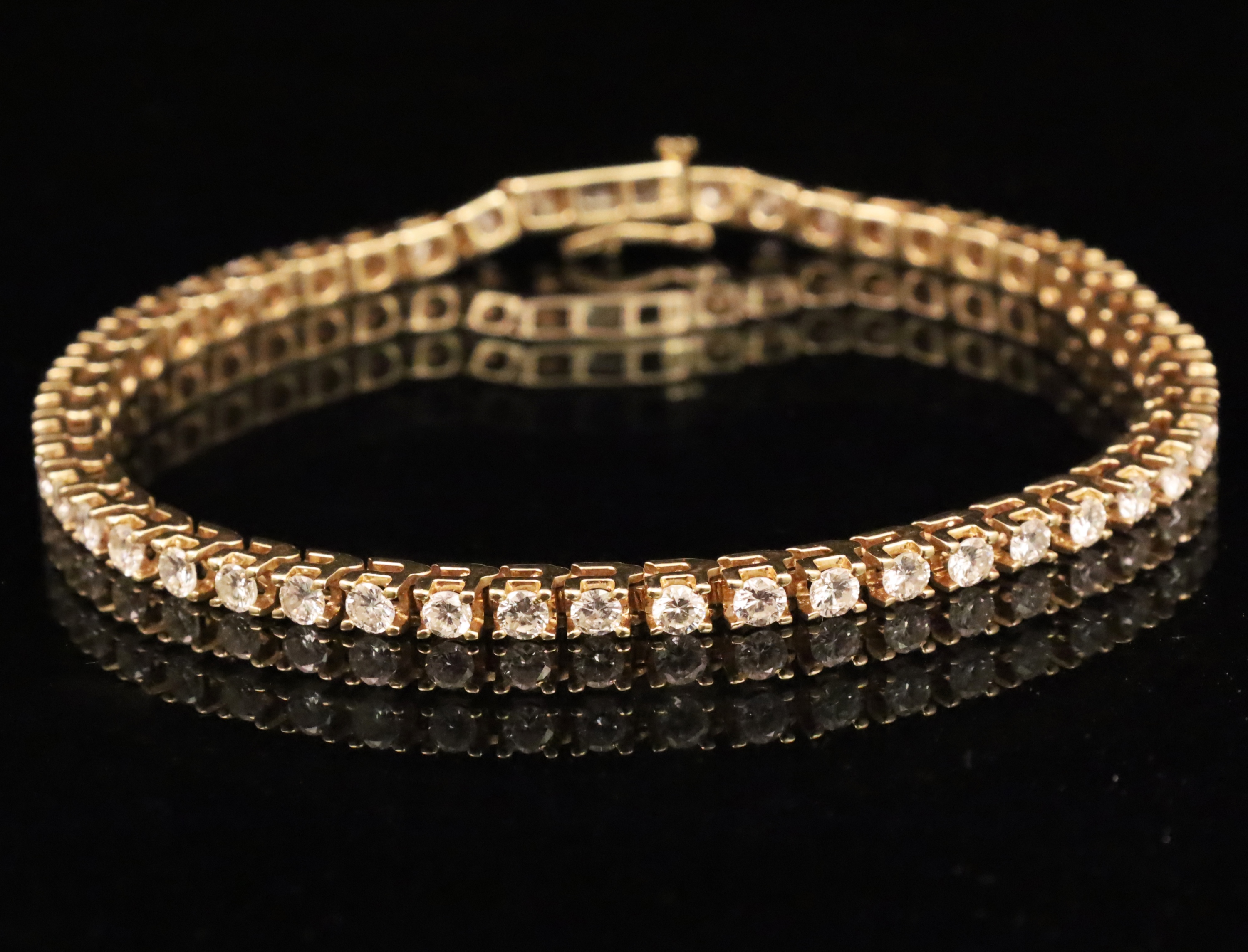 Appraisal: K YELLOW GOLD DIAMOND TENNIS BRACELET K yellow gold Diamond