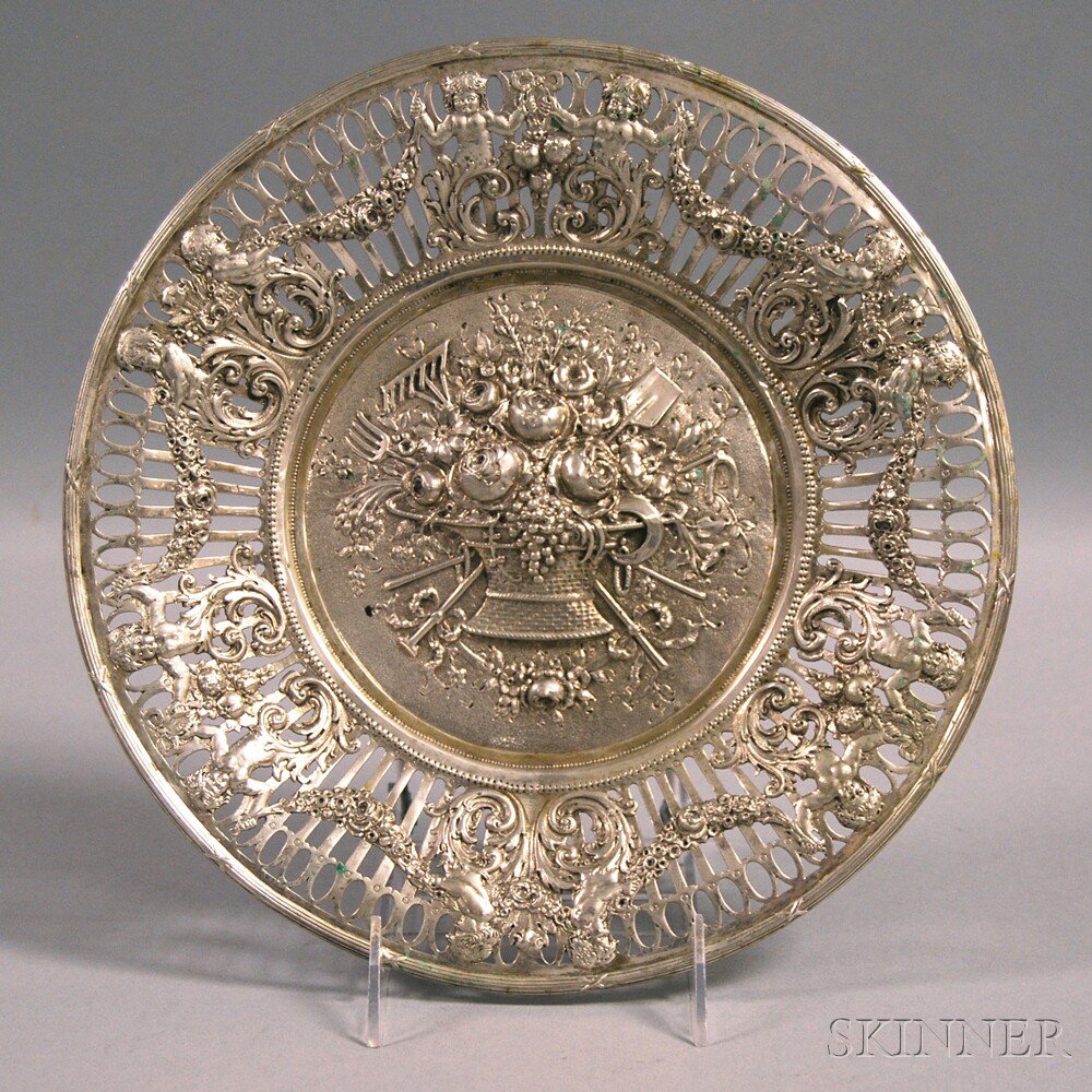 Appraisal: Repousse-decorated Silver Dish with a central basket filled with fruit