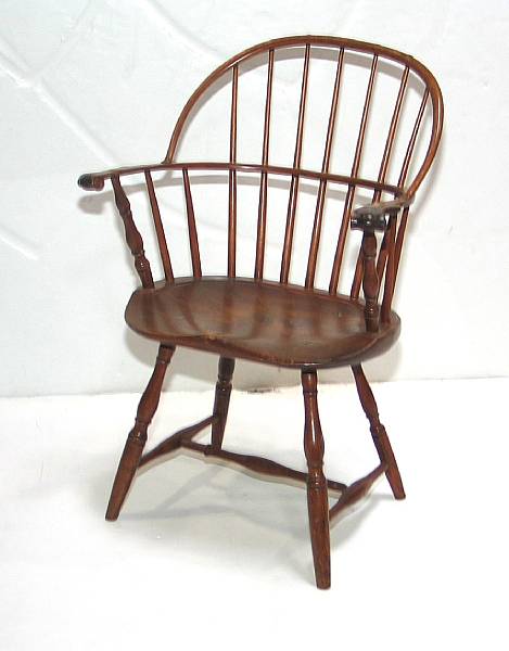 Appraisal: An American pine and maple sack back Windsor chair height