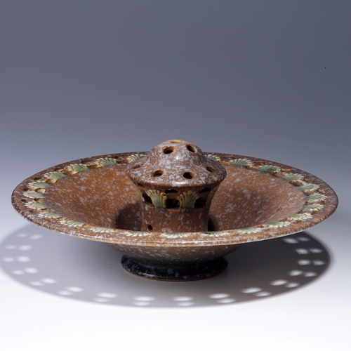 Appraisal: ROSEVILLE Brown Ferella flaring bowl with built-in flower frog Unmarked