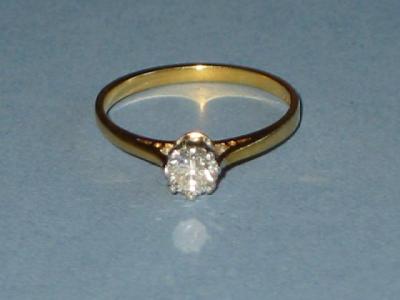 Appraisal: A SOLITAIRE DIAMOND RING brilliant cut and claw set on