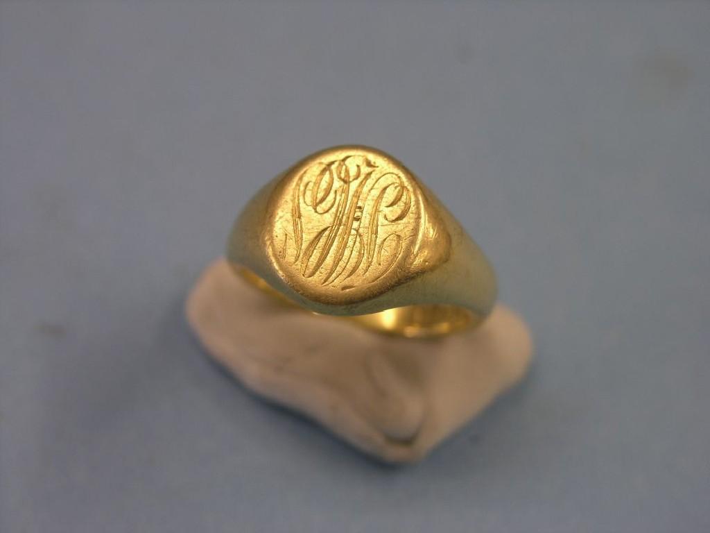 Appraisal: A large gentleman's ct gold signet ring monogrammed ring size