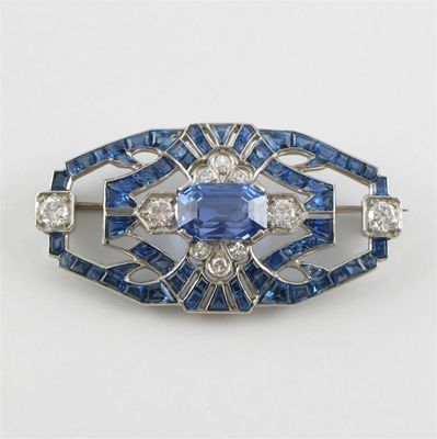 Appraisal: An Art Deco sapphire and diamond plaque brooch Centred with