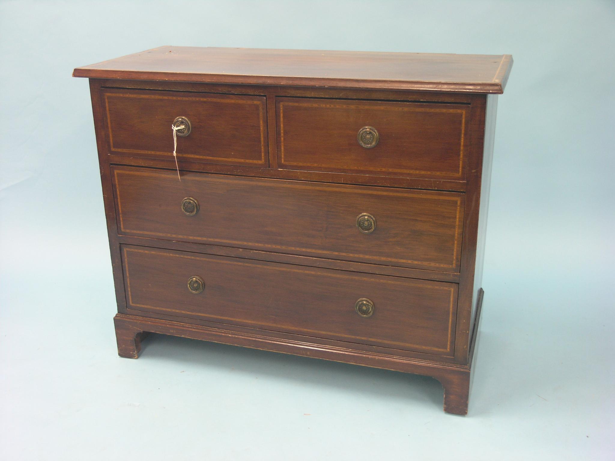 Appraisal: An Edwardian mahogany chest two short and two long drawers