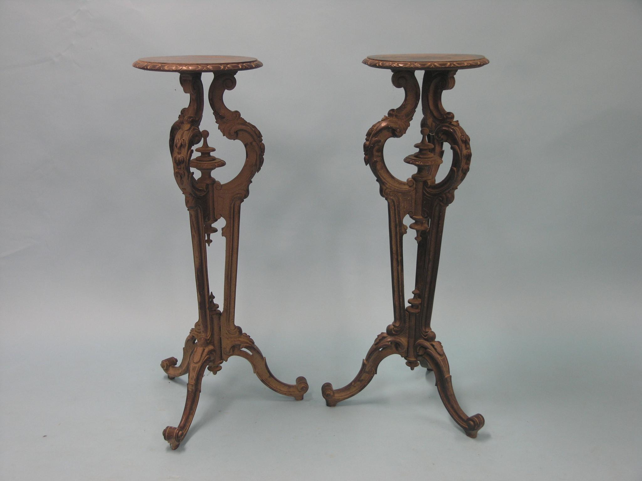 Appraisal: A pair of Victorian dark mahogany torcheres each with circular