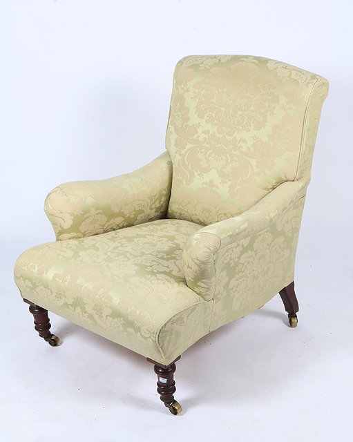 Appraisal: A VICTORIAN ARMCHAIR with green acanthus leaf decorated upholstery and