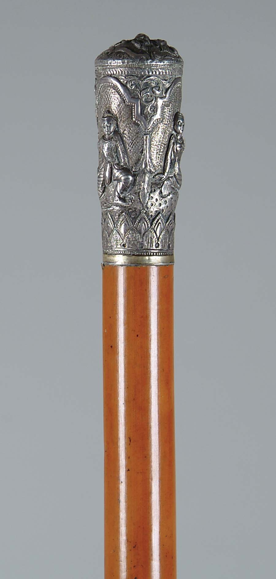 Appraisal: CANE SILVER HANDLE CANE WITH THAILAND MOTIF Unmarked silver top