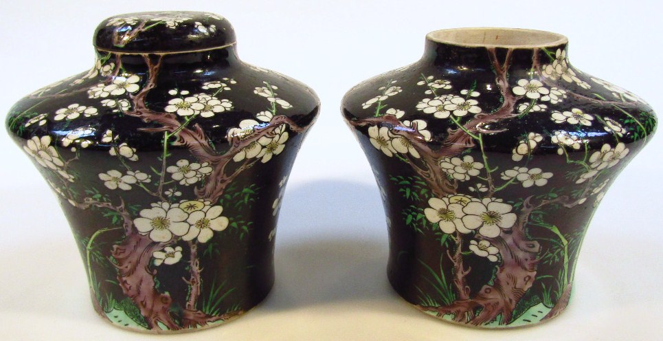 Appraisal: A pair of famille noir earthenware vases each with shouldered