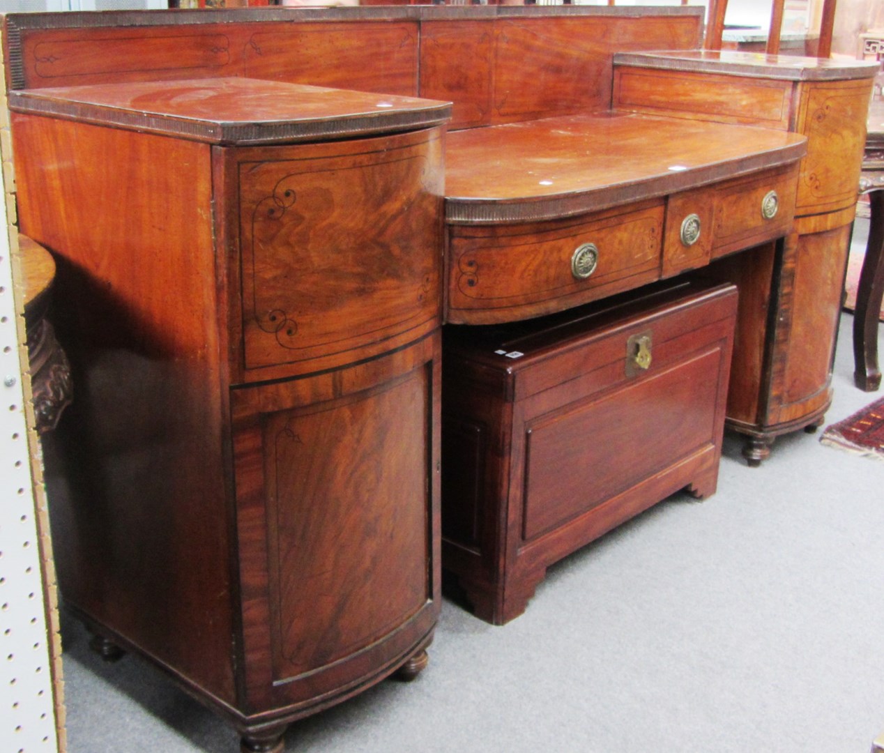 Appraisal: An early th century inlaid mahogany pedestal sideboard with pair