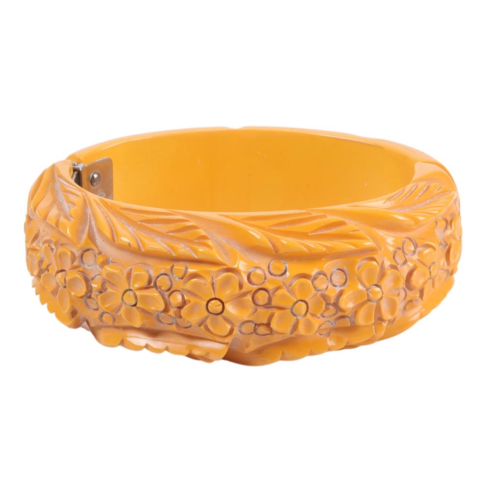 Appraisal: HINGED CREAM BAKELITE BRACELET WITH CARVED FLORAL DESIGN H X