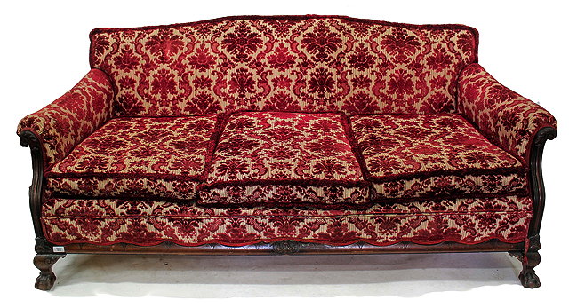 Appraisal: A VICTORIAN MAHOGANY FRAMED RED DRALON UPHOLSTERED CAMEL BACK SETTEE