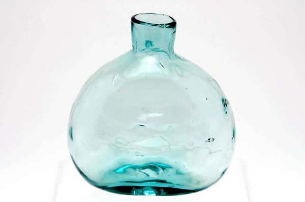 Appraisal: A blown glass aqua colored bottle with flared lip and