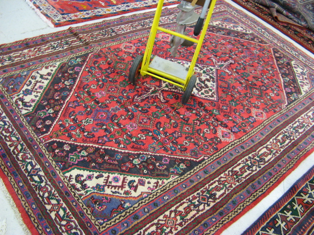 Appraisal: PERSIAN HAMADAN TRIBAL CARPET central diamond medallion and overall Herati