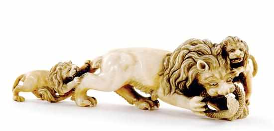 Appraisal: Continental carved ivory figural lion with cubs th century lion