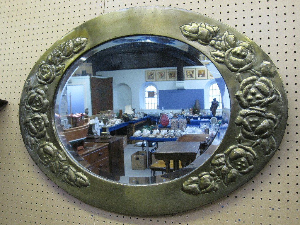 Appraisal: Oval embossed brass framed wall mirror