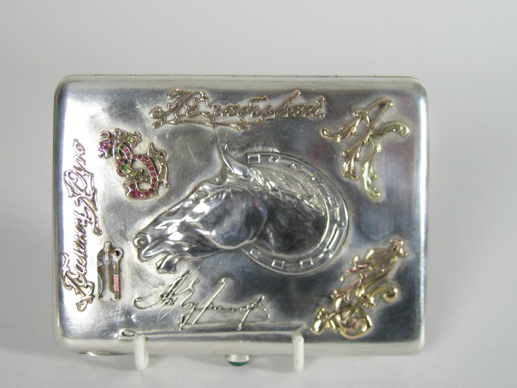 Appraisal: A Russian silver Cigarette Case the front embossed horses head