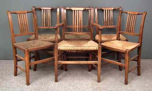 Appraisal: A set of six early th Century fruitwood dining chairs