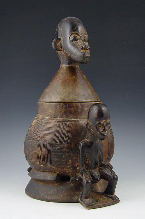 Appraisal: AFRICAN CARVED FIGURAL WOOD POT COOKER Figural man lid seated