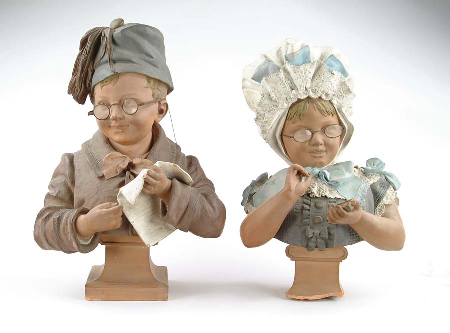 Appraisal: PAIR OF LARGE DECORATED TERRACOTTA BUSTS OF CHILDREN Boy with