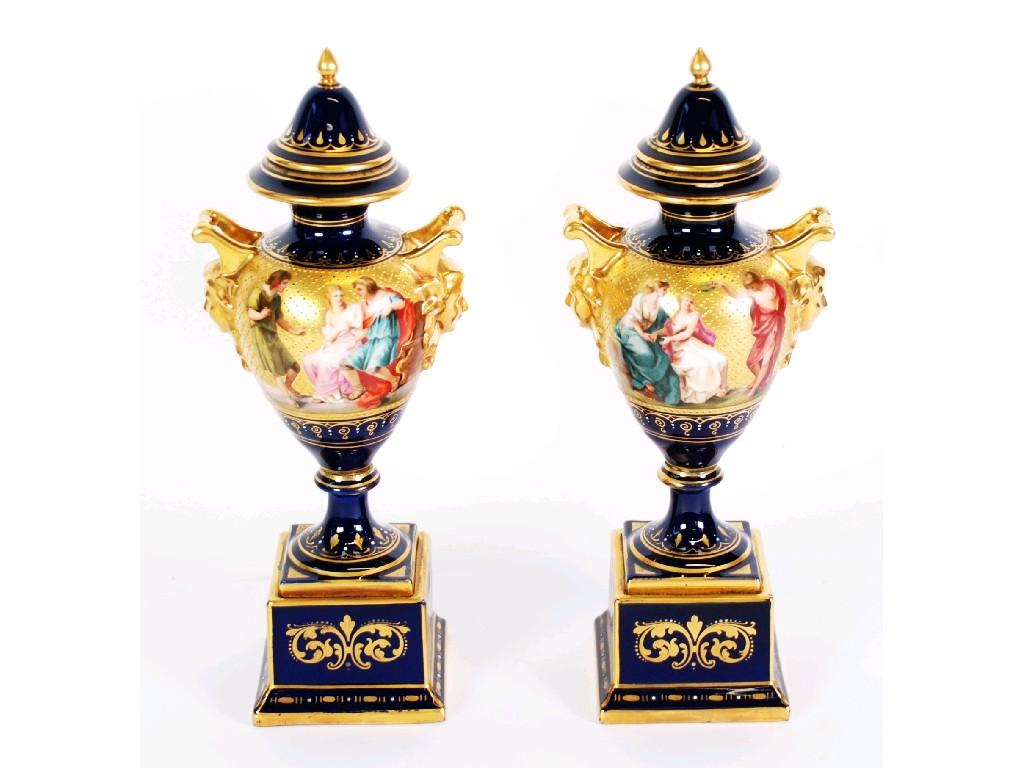 Appraisal: PAIR OF TWENTIETH CENTURY VIENNA PORCELAIN TWO HANDLED VASES with