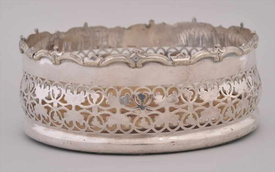 Appraisal: ENGLISH SILVERPLATE LARGE COASTER With wood base the swelling pierced