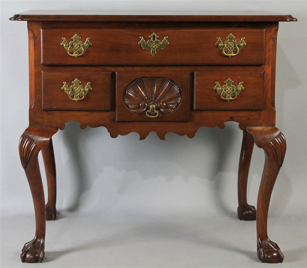 Appraisal: PHILADELPHIA CHIPPENDALE STYLE CARVED WALNUT LOWBOY having a rectangular overhanging